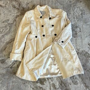 Cream color Trench coat in size L used a couple of times only.